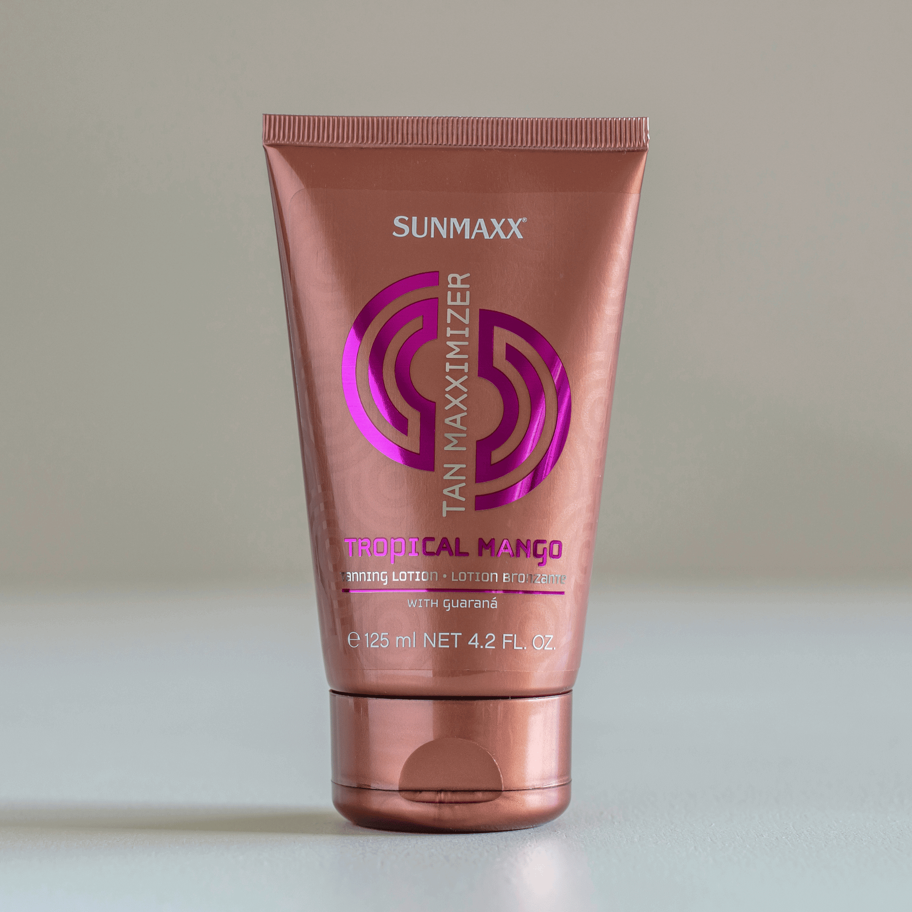 SUNMAXX TAN MAXXIMIZER Tropical Mango Bräunungslotion mit Selbstbräuner in brauner Tube.